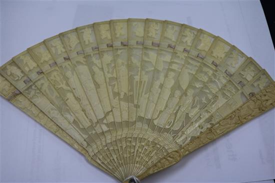 A Chinese ivory brise fan carved with figures